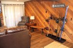 Mammoth Condo Rental Wildflower 41: Living room with Equipment Storage and Access to a Private Deck